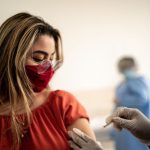 doctor giving patient an HVN vaccine shot